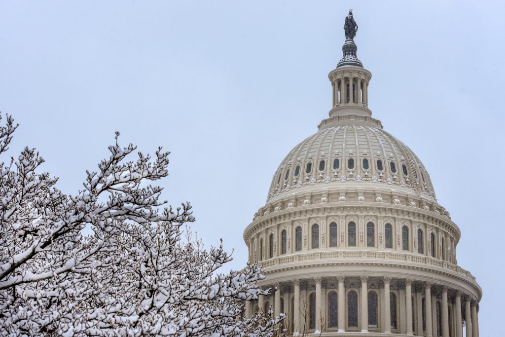 Winter scene of The United States Congress Capitol Building covered