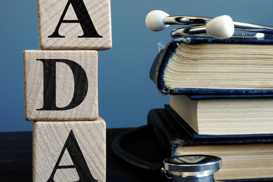 Word ADA Americans with Disabilities Act from cubes and books.