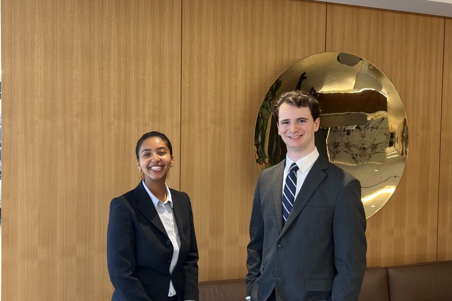 Saron Setotaw on the left and Aiden Wechsler on the right in the Powers Law Lobby.
