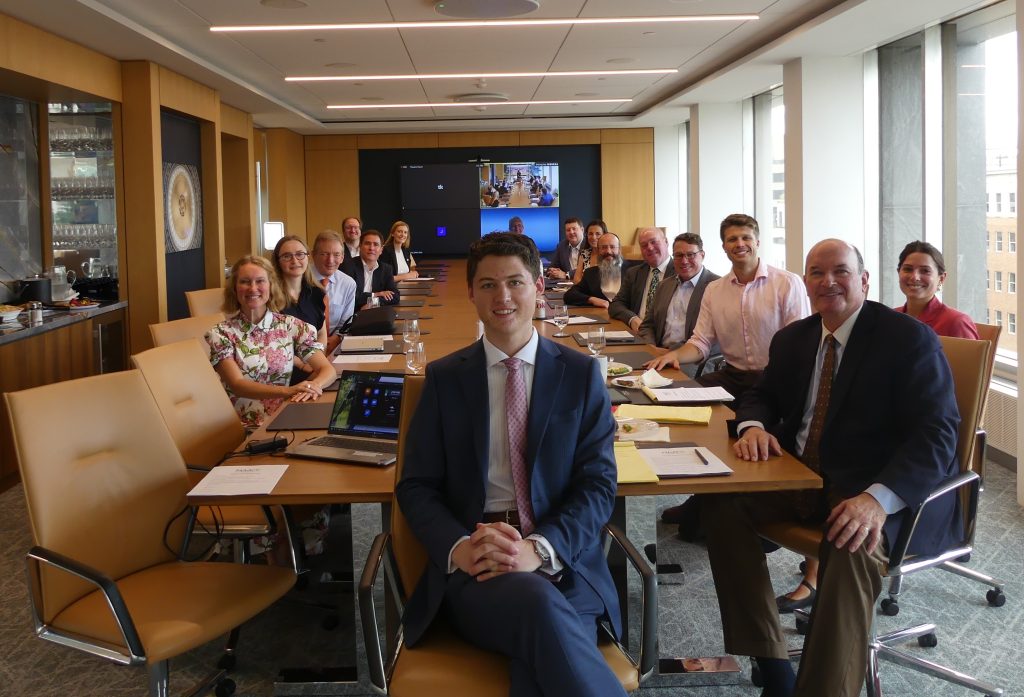 NAAOP Breece Fellow Elijah Brummond, center, with health care and O&P stakeholders gathered for a luncheon on Medicare amputee transitions in care hosted in Powers Pyles Sutter & Verville's main conference room.