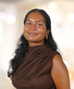 Moksha Visanagiri headshot in front of a blurred office background