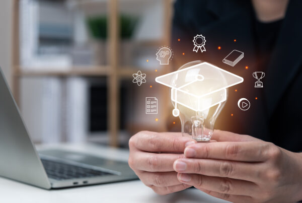 E-learning graduate certificate program concept, businessman hand holding light bulb with Internet education course degree, study knowledge, creative thinking idea, problem solving solution, AI.